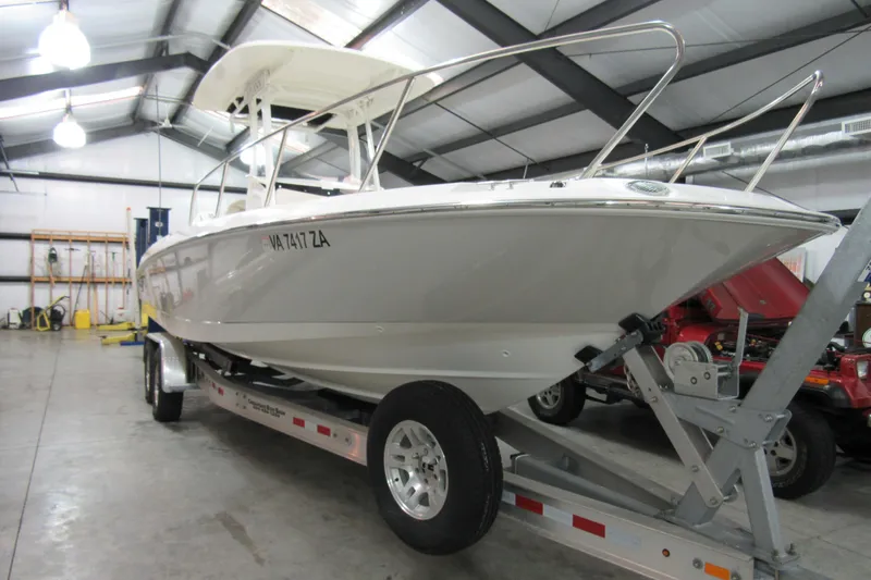Slide: The Image of 2019 Boston Whaler 270 Dauntless boat on trailer in indoor storage facility. - 2