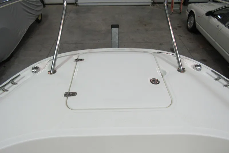 Slide: The Image of 2019 Boston Whaler 270 Dauntless boat deck with storage hatch and railings. - 24
