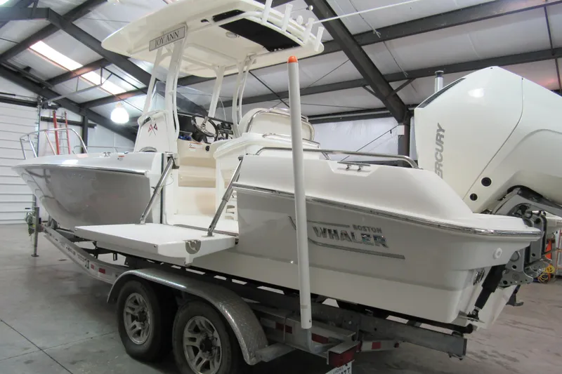 Slide: The Image of 2019 Boston Whaler 270 Dauntless boat on trailer in indoor storage. - 4
