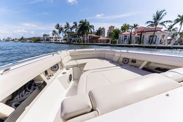 Slide: The Image of 2019 Boston Whaler 270 Dauntless boat with covered console, docked outdoors. - 49