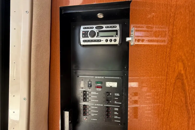 Slide: The Image of Control panel and stereo system inside 2009 Sea Ray 270 Sundancer boat. - 27