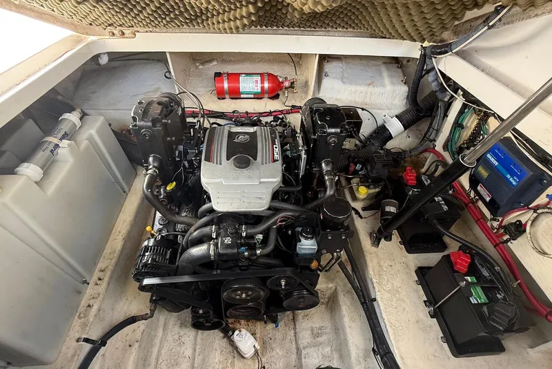 Slide: The Image of Engine compartment of a 2009 Sea Ray 270 Sundancer boat, featuring a well-maintained motor. - 35