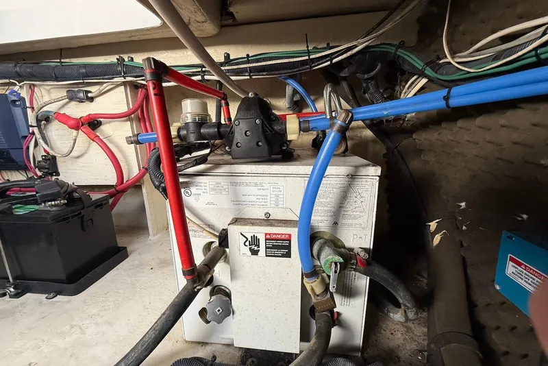 Slide: The Image of Engine compartment of 2009 Sea Ray 270 Sundancer with wiring and components visible. - 36