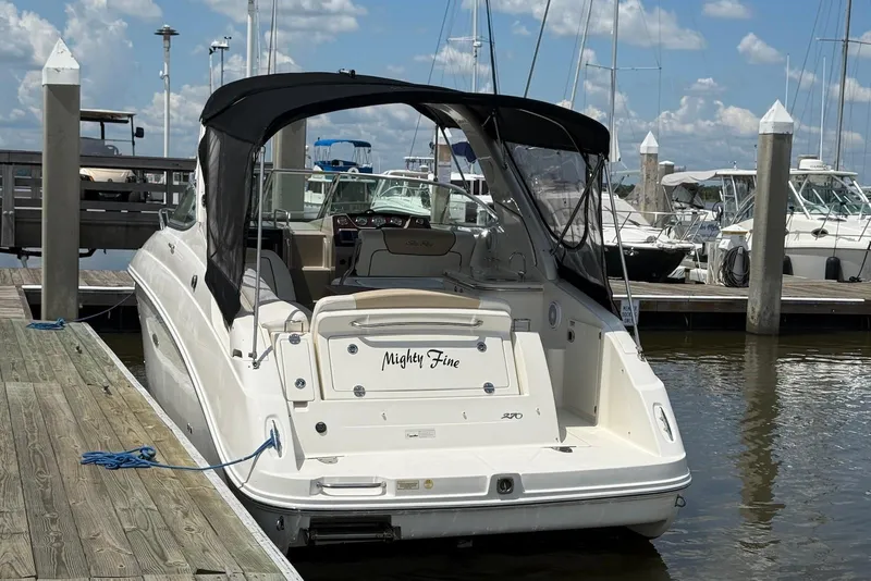 Slide: The Image of 2009 Sea Ray 270 Sundancer docked at marina under clear blue sky. - 4