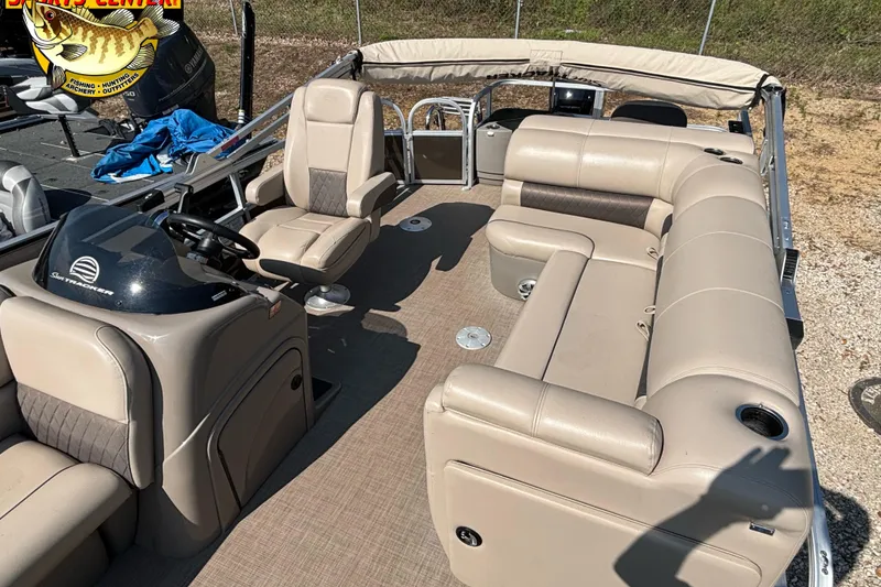 Slide: The Image of 2023 Sun Tracker SportFish 20 DLX pontoon boat with beige seating and steering console. - 5