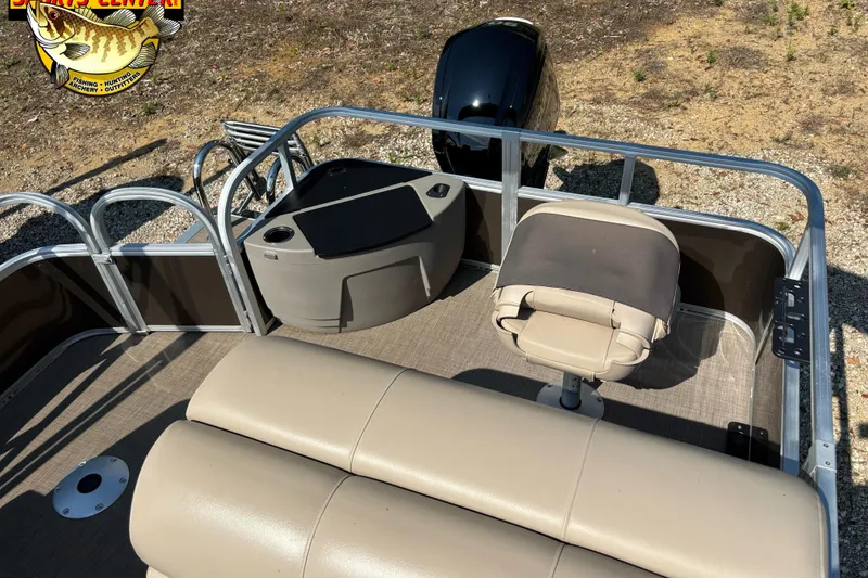 Slide: The Image of 2023 Sun Tracker SportFish 20 DLX pontoon boat interior with seating and console. - 6