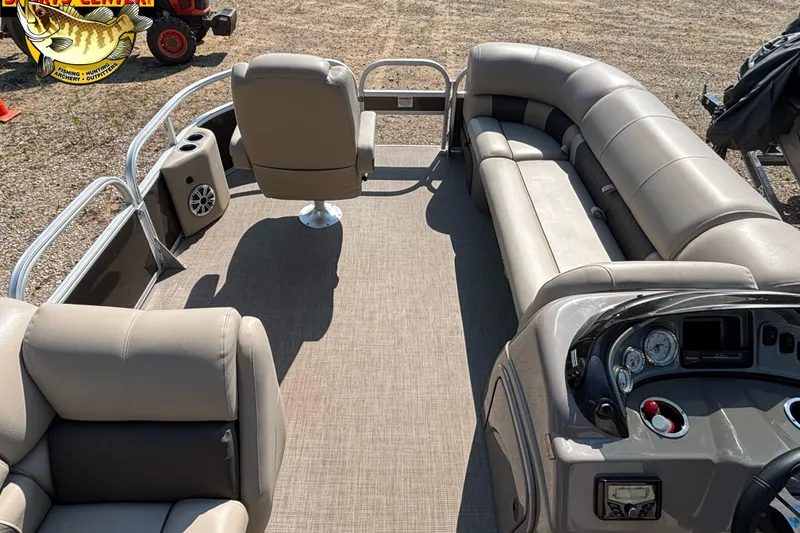 Slide: The Image of 2023 Sun Tracker SportFish 20 DLX interior with seating and control panel. - 9