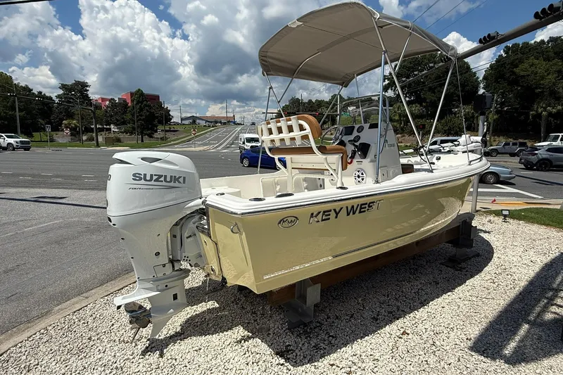 Slide: The Image of 2026 Key West 1720 Center Console boat with Suzuki engine on display outdoors. - 4