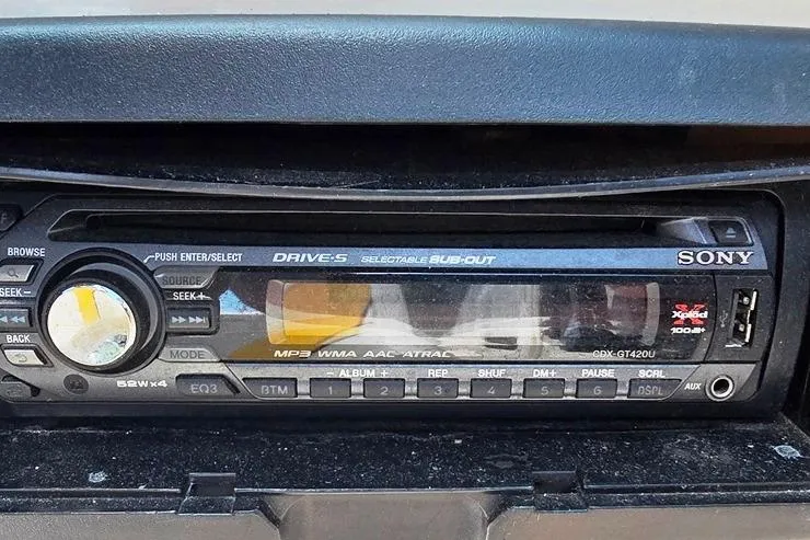 Slide: The Image of Sony car stereo in a 2002 Rinker 212 Captiva BR boat dashboard. - 14