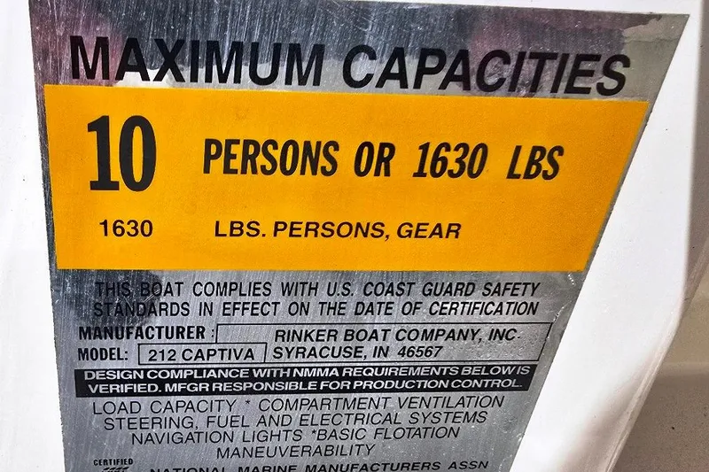 Slide: The Image of 2002 Rinker 212 Captiva BR capacity label: 10 persons or 1630 lbs. - 16