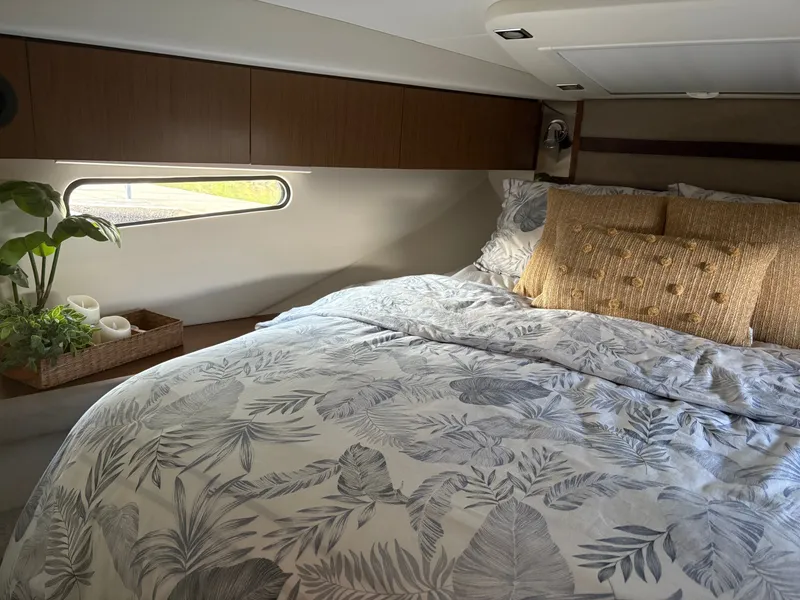 Slide: The Image of Luxurious cabin interior of 2017 Cruisers Yachts 380 Express with elegant bedding and decor. - 11