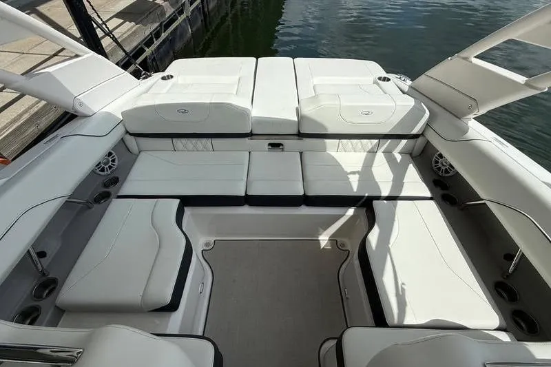 Slide: The Image of 2023 Regal LS2 boat interior with white seating and sleek design. - 13