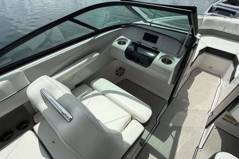 Slide: The Image of 2023 Regal LS2 boat interior with white seating and modern dashboard design. - 8