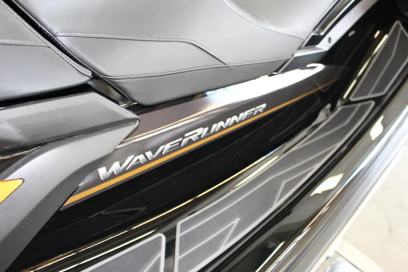 Slide: The Image of 2025 Yamaha FX Cruiser High Output WaveRunner, sleek black design with comfortable seating. - 11