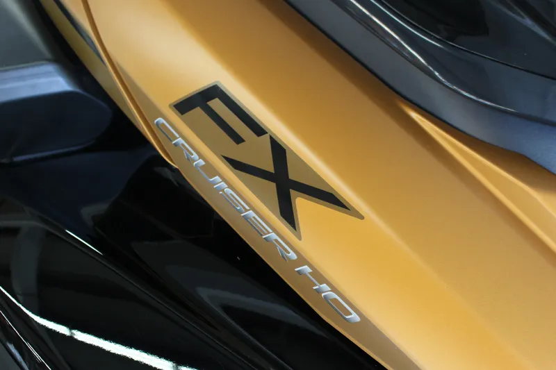 Slide: The Image of 2025 Yamaha FX Cruiser High Output, close-up of sleek gold and black design. - 12