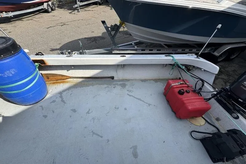 Slide: The Image of 2001 ROS Boats 19 RUNABOUT deck with fuel tank and blue barrel. - 10