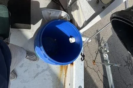 Slide: The Image of Blue bucket on 2001 ROS Boats 19 RUNABOUT deck, near fishing rod holder. - 4