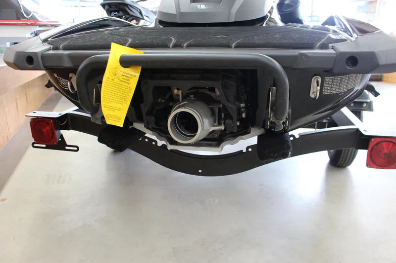 Slide: The Image of 2025 Yamaha GP 1800 SVHO jet ski rear view on trailer in showroom. - 8