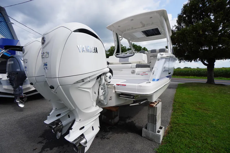 Slide: The Image of 2025 Chaparral 280 OSX boat with Yamaha engines on display outdoors. - 10