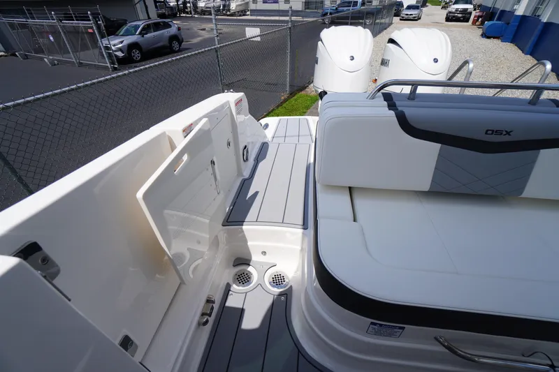 Slide: The Image of 2025 Chaparral 280 OSX boat deck with seating and storage compartments. - 38