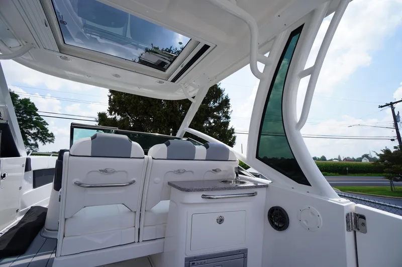 Slide: The Image of 2025 Chaparral 280 OSX boat interior with sleek seating and modern design. - 49