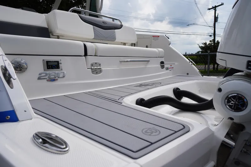 Slide: The Image of 2025 Chaparral 280 OSX boat deck with seating and engine details. - 5