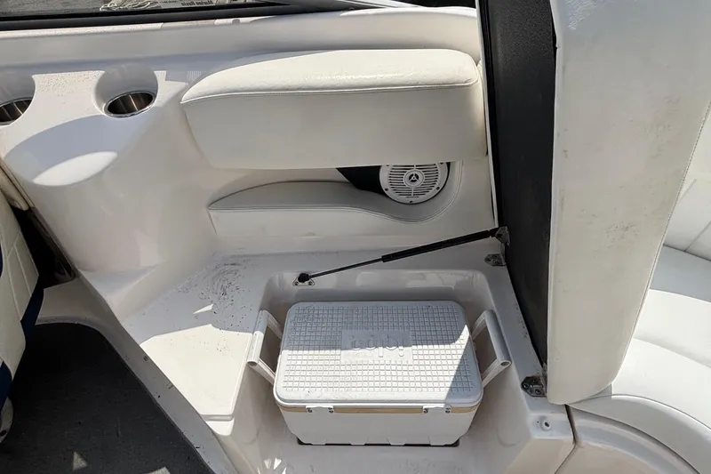 Slide: The Image of 2007 Regal 2400 Bowrider interior with storage compartment and cooler. - 9