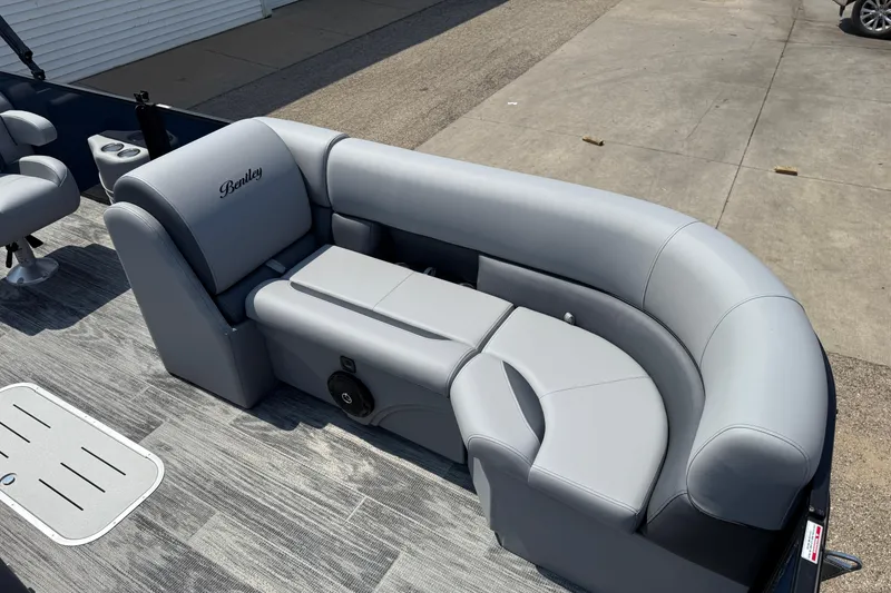 Slide: The Image of 2026 Bentley Pontoons Legacy 223 Swingback with luxurious gray seating on deck. - 10