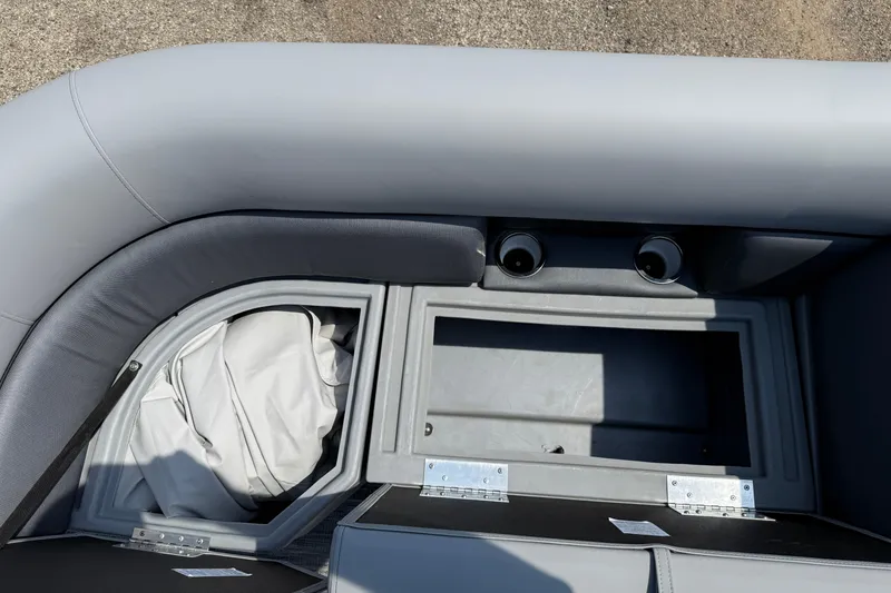 Slide: The Image of 2026 Bentley Pontoons Legacy 223 Swingback interior storage compartments and seating detail. - 12