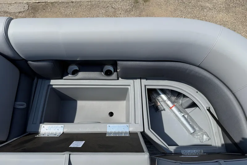 Slide: The Image of 2026 Bentley Pontoons Legacy 223 Swingback interior storage compartments and cup holders. - 13