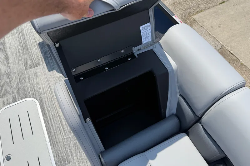 Slide: The Image of Open storage compartment in 2026 Bentley Pontoons Legacy 223 Swingback boat seat. - 14