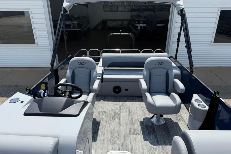 Slide: The Image of 2026 Bentley Pontoons Legacy 223 Swingback interior with modern seating and steering console. - 15