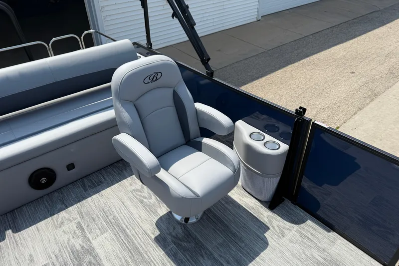 Slide: The Image of 2026 Bentley Pontoons Legacy 223 Swingback interior with luxurious seating and cup holders. - 17