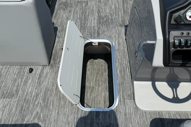 Slide: The Image of Open storage compartment on 2026 Bentley Pontoons Legacy 223 Swingback boat deck. - 18