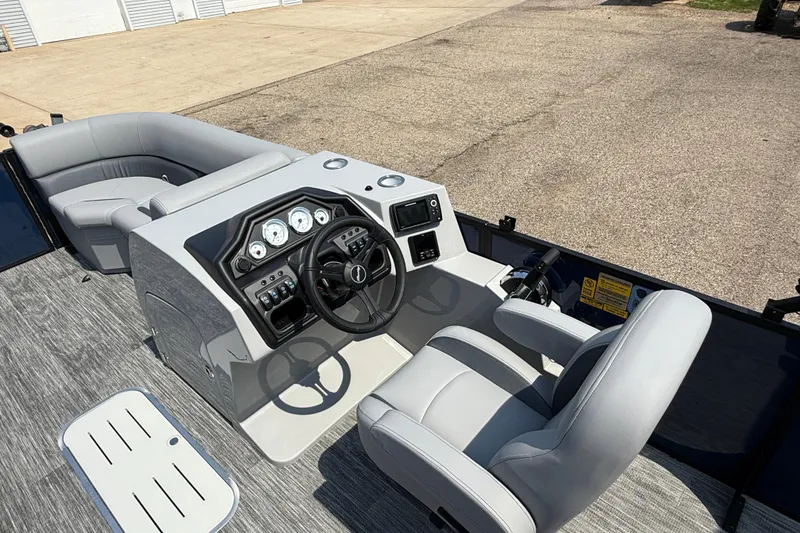 Slide: The Image of 2026 Bentley Pontoons Legacy 223 Swingback interior with modern helm and seating. - 19