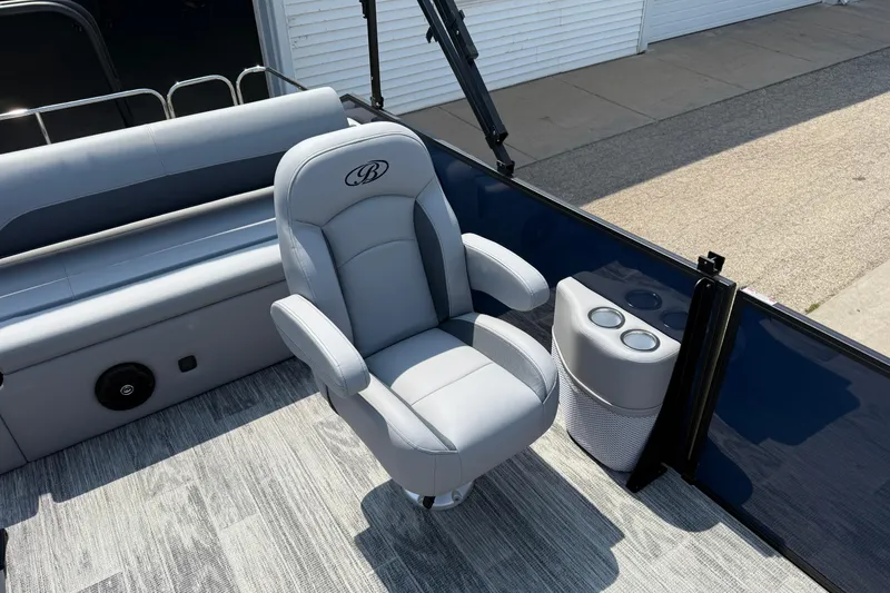 Slide: The Image of 2026 Bentley Pontoons Legacy 223 Swingback interior with plush seating and cup holders. - 22