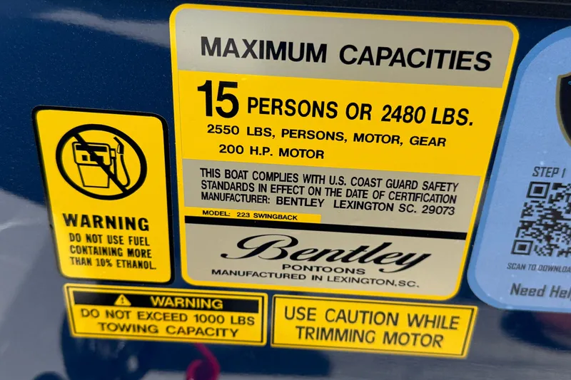 Slide: The Image of 2026 Bentley Pontoons Legacy 223 Swingback capacity label, 15 persons, 2480 lbs, 200 HP motor. - 31