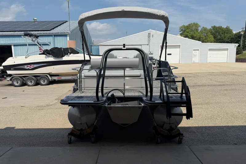 Slide: The Image of 2026 Bentley Pontoons Legacy 223 Swingback in a marina, showcasing sleek design and modern features. - 6