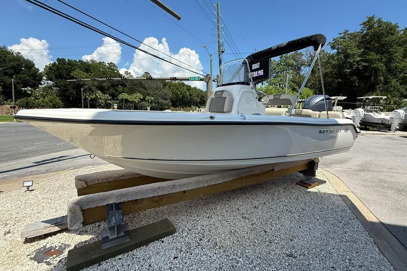 Slide: The Image of 2025 Key West 189 FS boat displayed outdoors on a stand. - 4