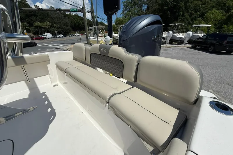 Slide: The Image of 2025 Key West 189 FS boat interior with beige seating and Yamaha outboard motor. - 9