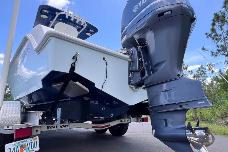 Slide: The Image of 2017 Contender 24 Sport boat on trailer with Yamaha outboard motor. - 14