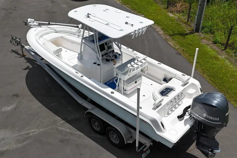 Slide: The Image of 2017 Contender 24 Sport boat on trailer with Yamaha outboard engine. - 2