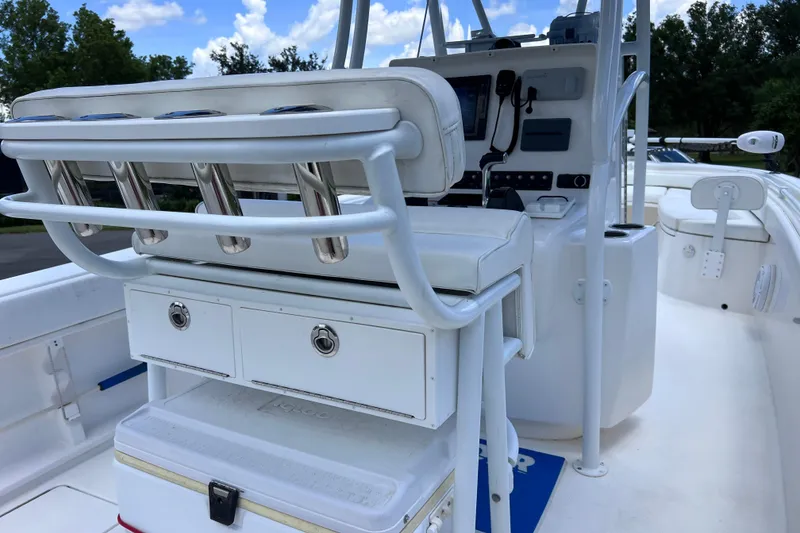 Slide: The Image of 2017 Contender 24 Sport boat interior with helm station and seating. - 24