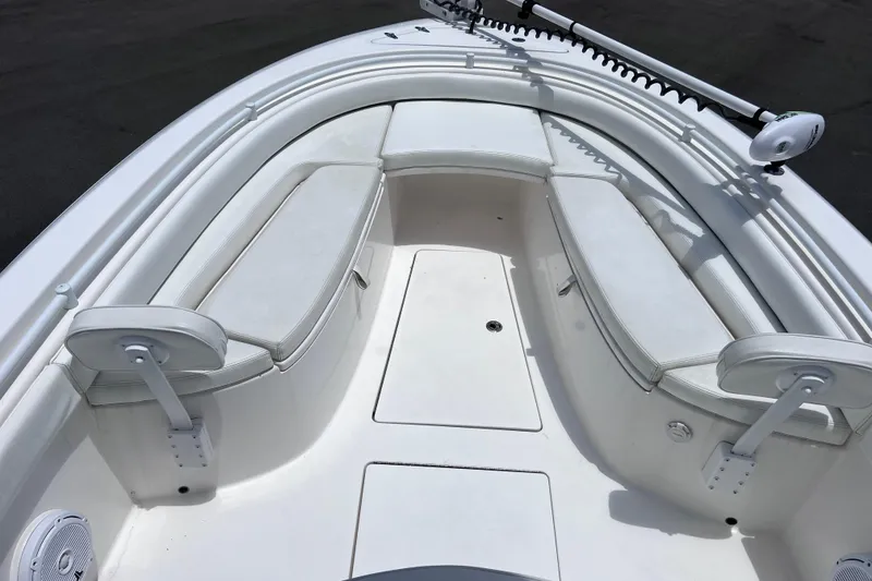 Slide: The Image of 2017 Contender 24 Sport boat interior with white seating and deck. - 31