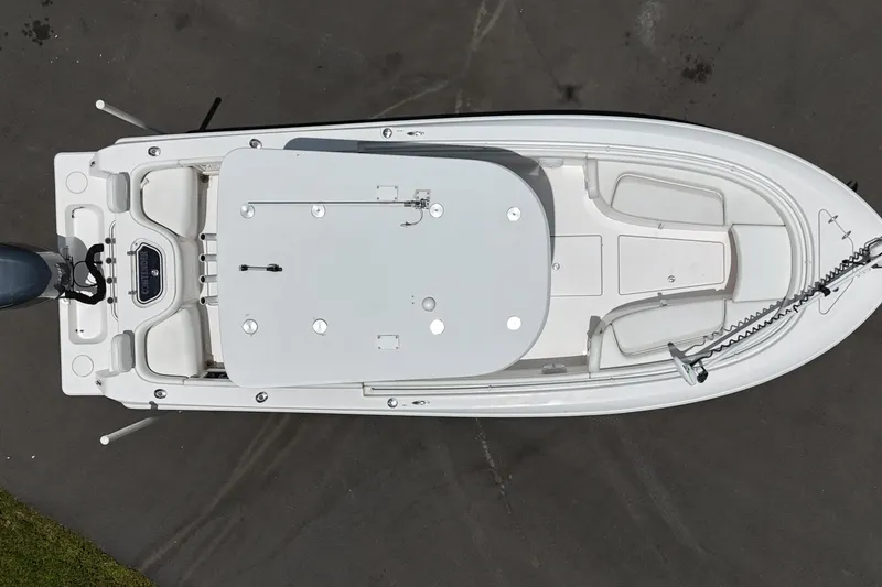 Slide: The Image of Top view of a 2017 Contender 24 Sport boat, showcasing deck layout and seating. - 4