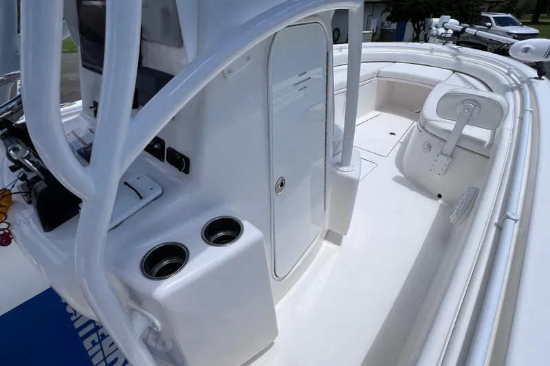 Slide: The Image of 2017 Contender 24 Sport boat interior with seating and storage compartments. - 44