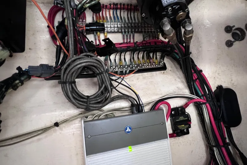 Slide: The Image of Electrical wiring and components inside a 2017 Contender 24 Sport boat. - 47