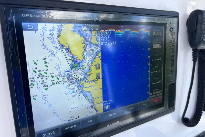 Slide: The Image of Garmin GPS display on 2017 Contender 24 Sport boat, showing nautical map and sonar data. - 51