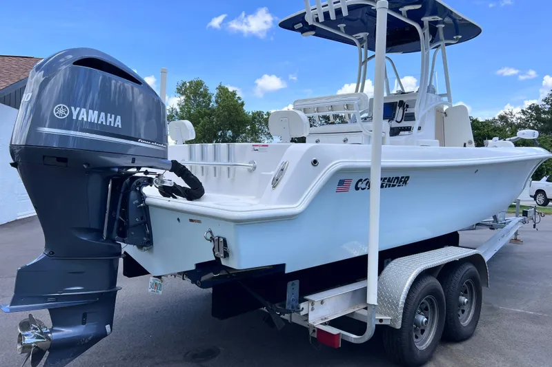 Slide: The Image of 2017 Contender 24 Sport boat with Yamaha outboard engine on a trailer. - 7