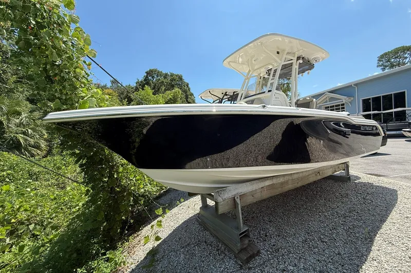 The Image of 2026 Key West 239 FS boat on display, sleek black hull, sunny day. - 0